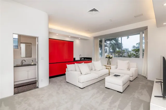 a front view of multiple houses with yard