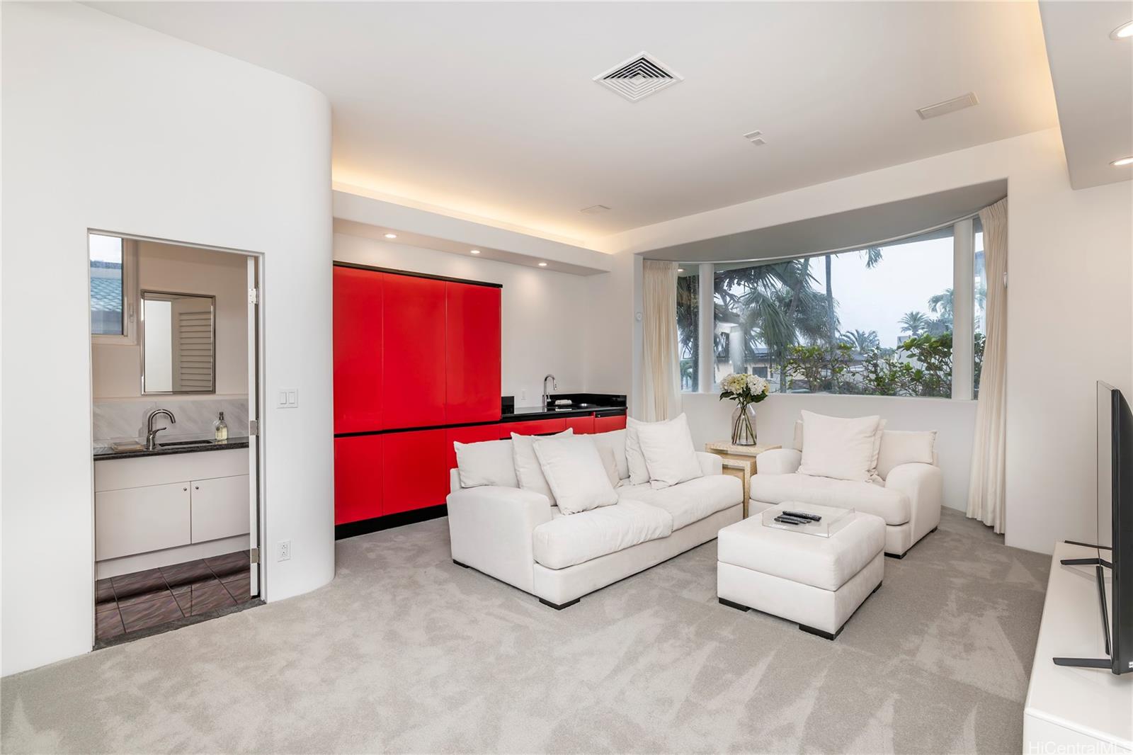 875 Ikena Circle Honolulu, HI 96821 - Photo 20 of 22 a living room with furniture and a large window