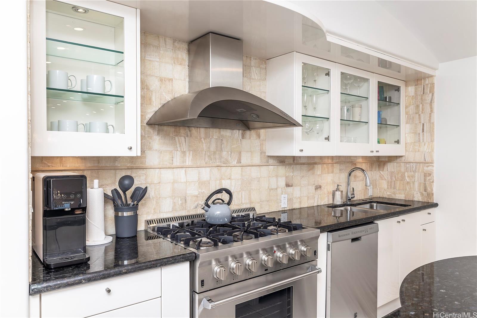875 Ikena Circle Honolulu, HI 96821 - Photo 6 of 22 a kitchen with a stove and cabinets
