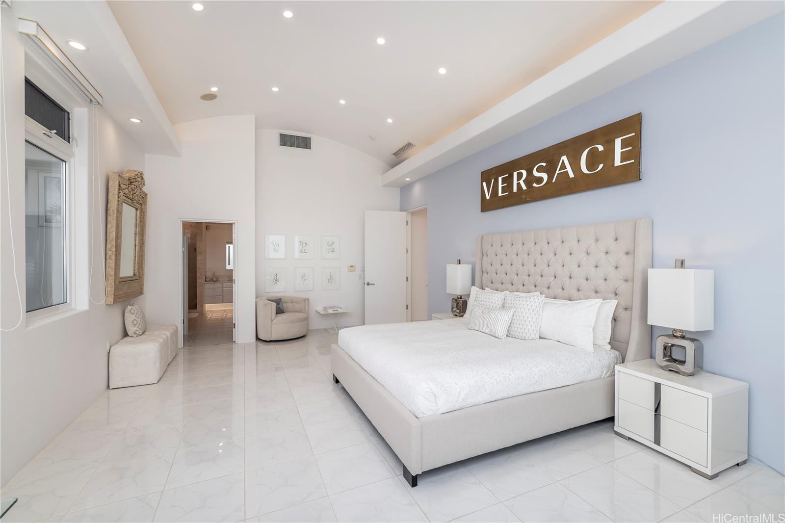 875 Ikena Circle Honolulu, HI 96821 - Photo 8 of 22 a bedroom with a bed and a couch