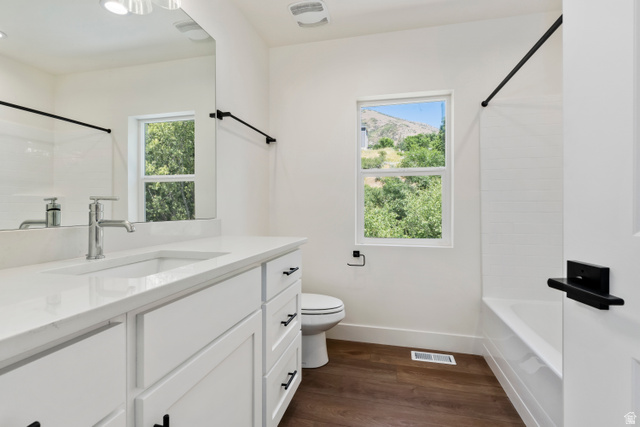 504 North 650 E Street Springville, UT 84663 - Photo 23 of 36 Modern bathroom featuring a white vanity with integrated sink, quartz countertop, and brushed nickel faucet