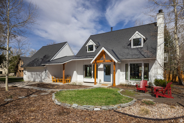 2554 Little Kate Road Park City, UT 84060 - Photo 1 of 1 Modern inspired farmhouse with covered porch, a chimney, roof with shingles, and board and batten siding