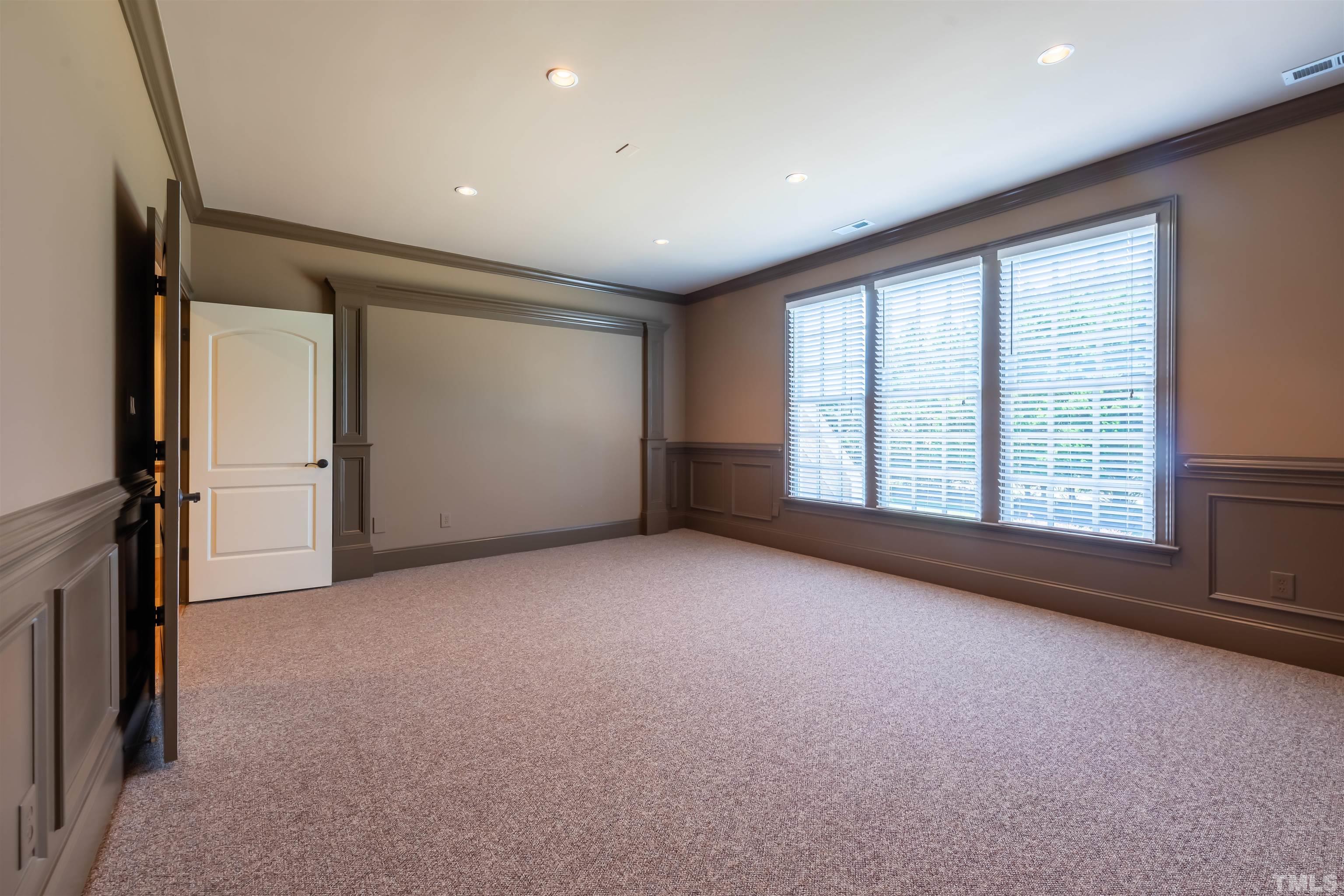 9805 Najma Street Raleigh, NC 27613 - Photo 25 of 29 an empty room with windows