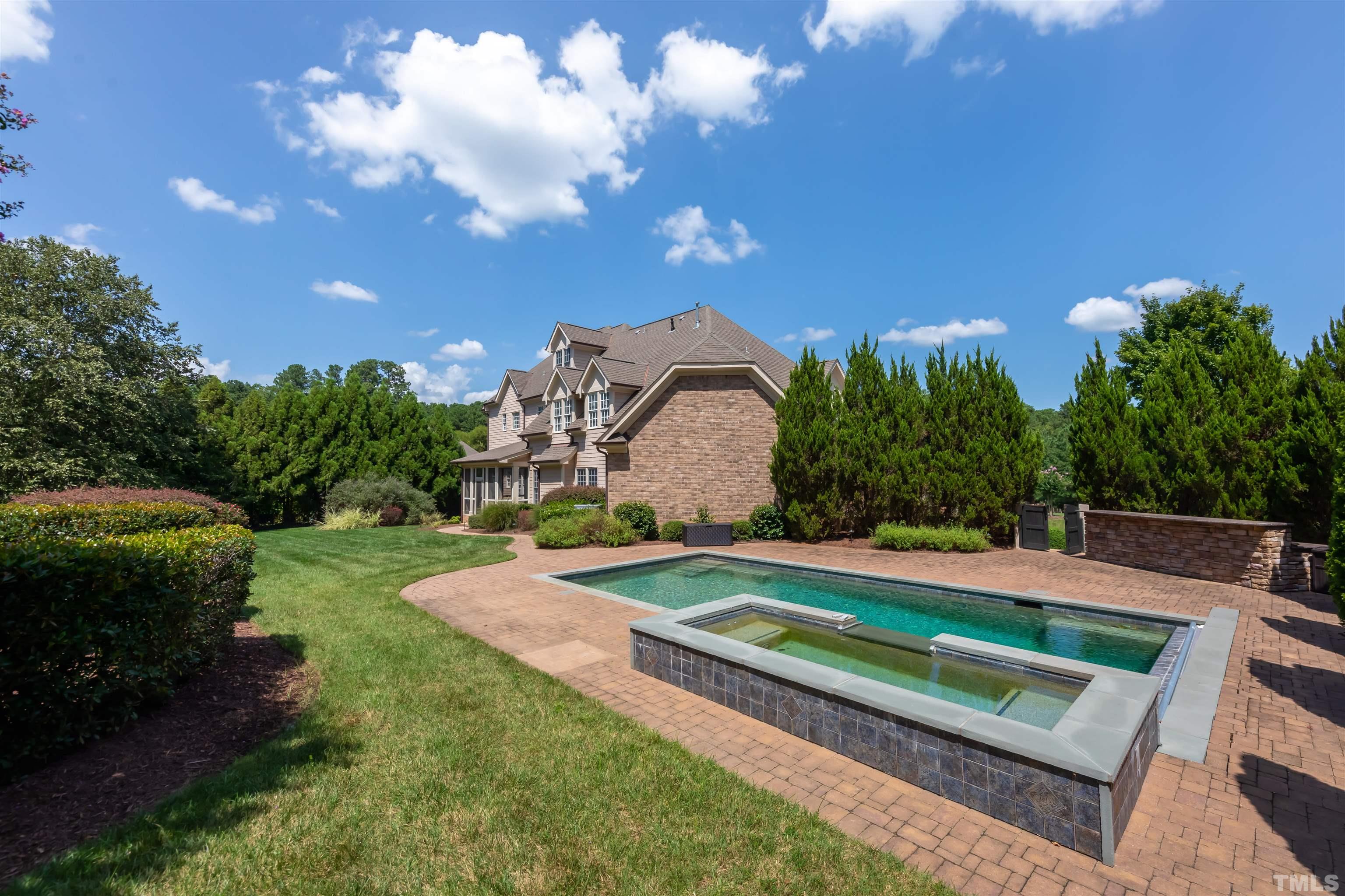 9805 Najma Street Raleigh, NC 27613 - Photo 28 of 29 a view of a backyard with swimming pool and seating area