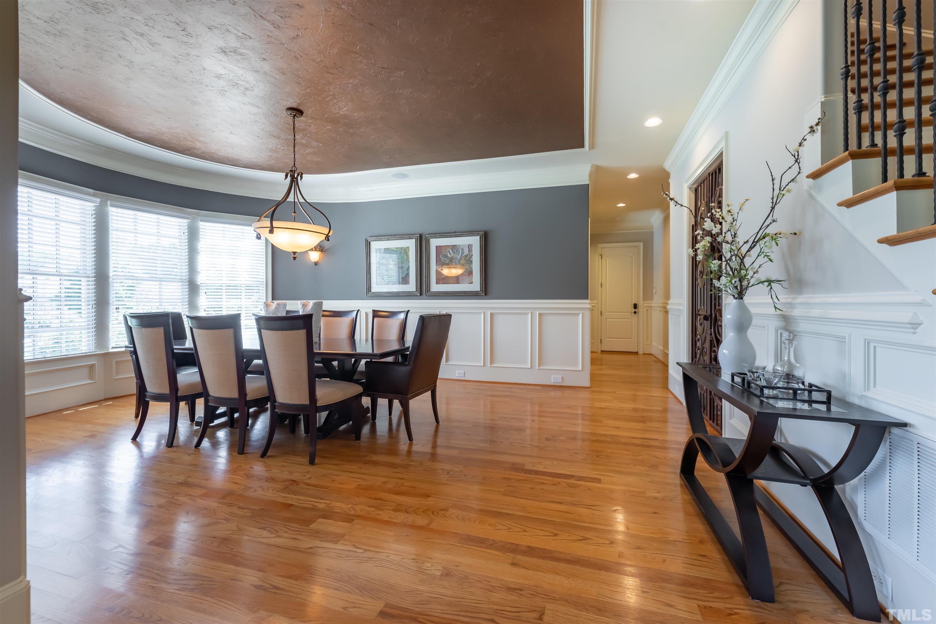 9805 Najma Street Raleigh, NC 27613 - Photo 5 of 29 a view of a dining room with furniture window and wooden floor