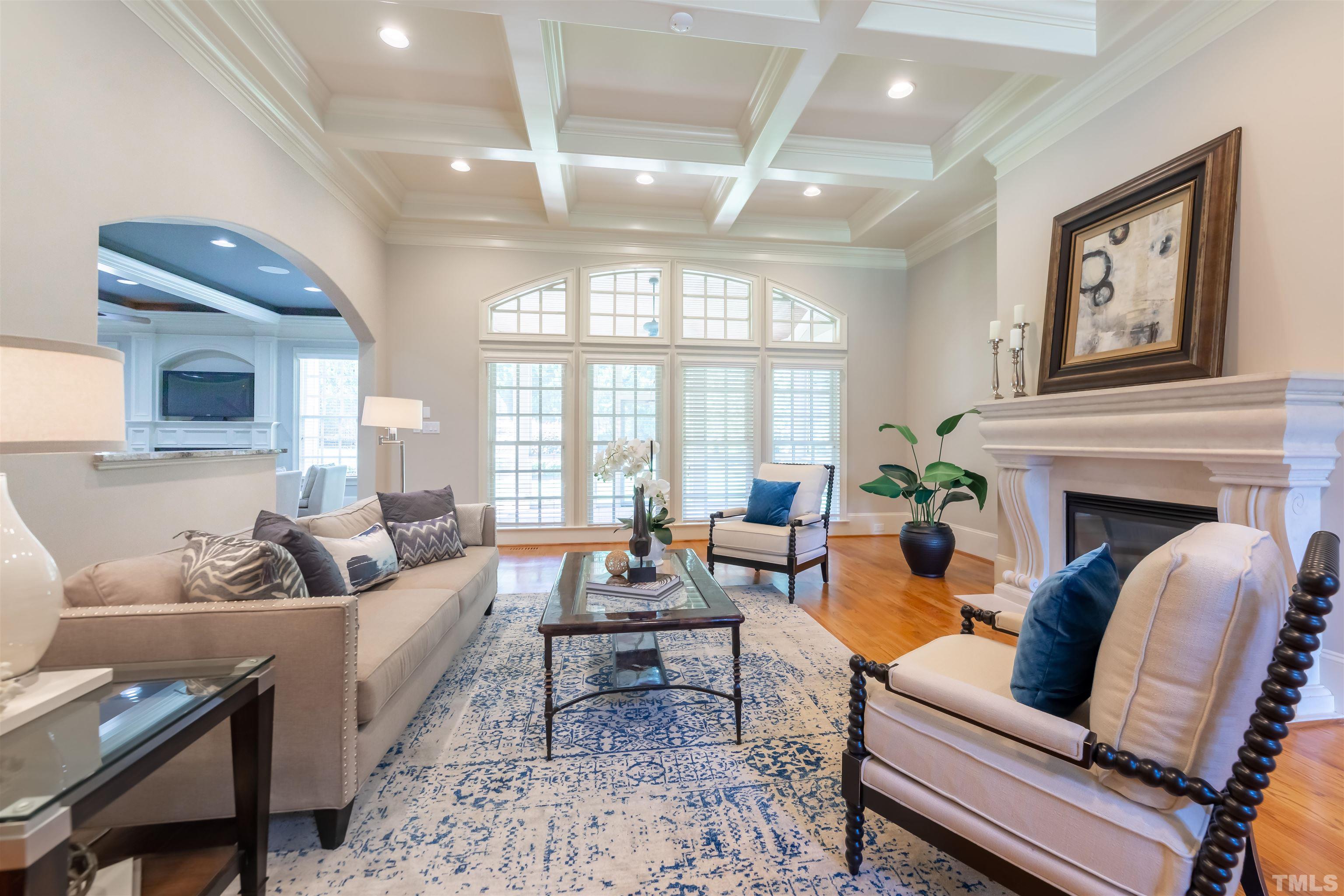 9805 Najma Street Raleigh, NC 27613 - Photo 9 of 29 a living room with furniture fireplace and a large window
