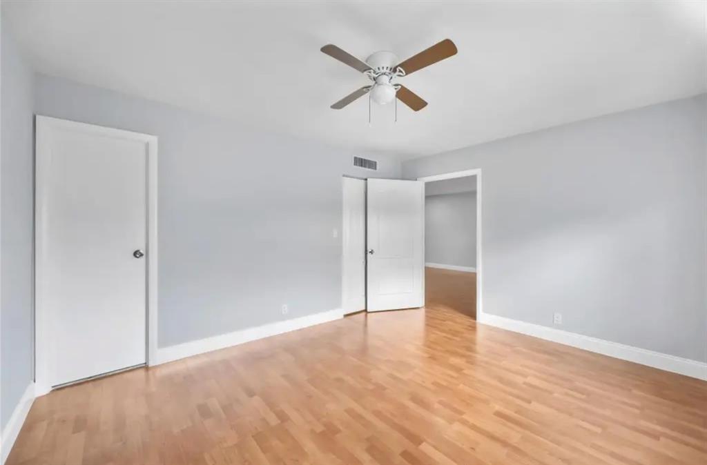 6100 South Falls Cir Drive, Unit 204 Lauderhill, FL 33319 - Photo 15 of 27 a view of empty room with wooden floor