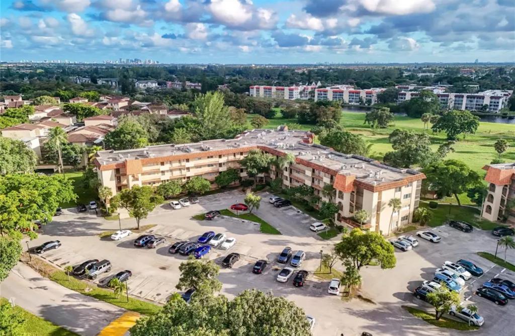 6100 South Falls Cir Drive, Unit 204 Lauderhill, FL 33319 - Photo 19 of 27 an aerial view of a house with a garden