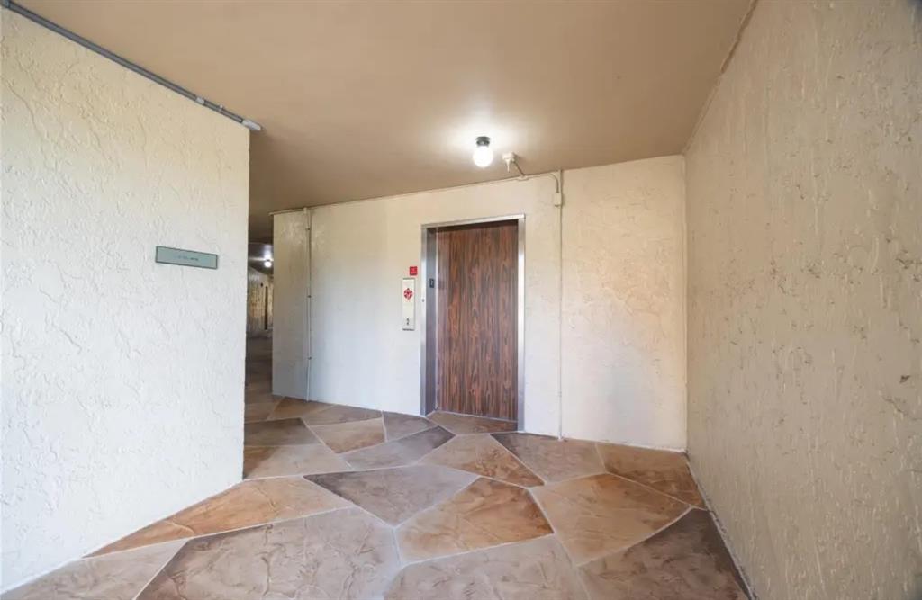 6100 South Falls Cir Drive, Unit 204 Lauderhill, FL 33319 - Photo 27 of 27 a view of a big room with closet and wooden door