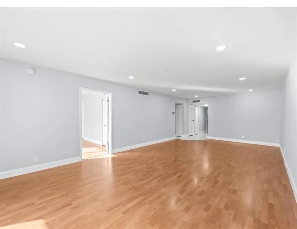 6100 South Falls Cir Drive, Unit 204 Lauderhill, FL 33319 - Photo 3 of 27 a view of an empty room with wooden floor