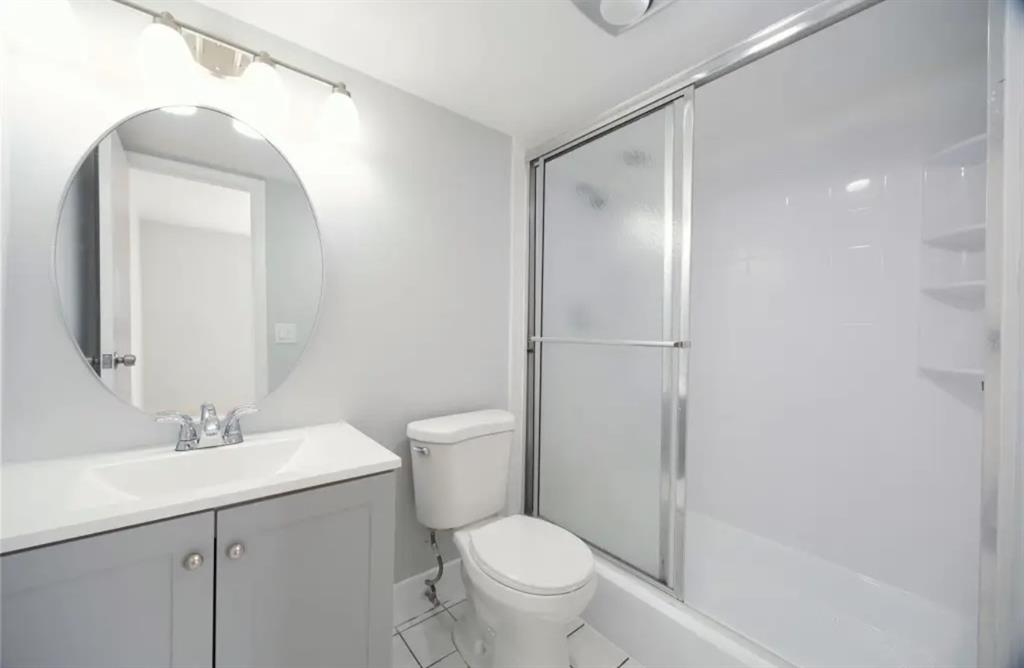 6100 South Falls Cir Drive, Unit 204 Lauderhill, FL 33319 - Photo 10 of 27 a bathroom with a toilet a sink and a mirror