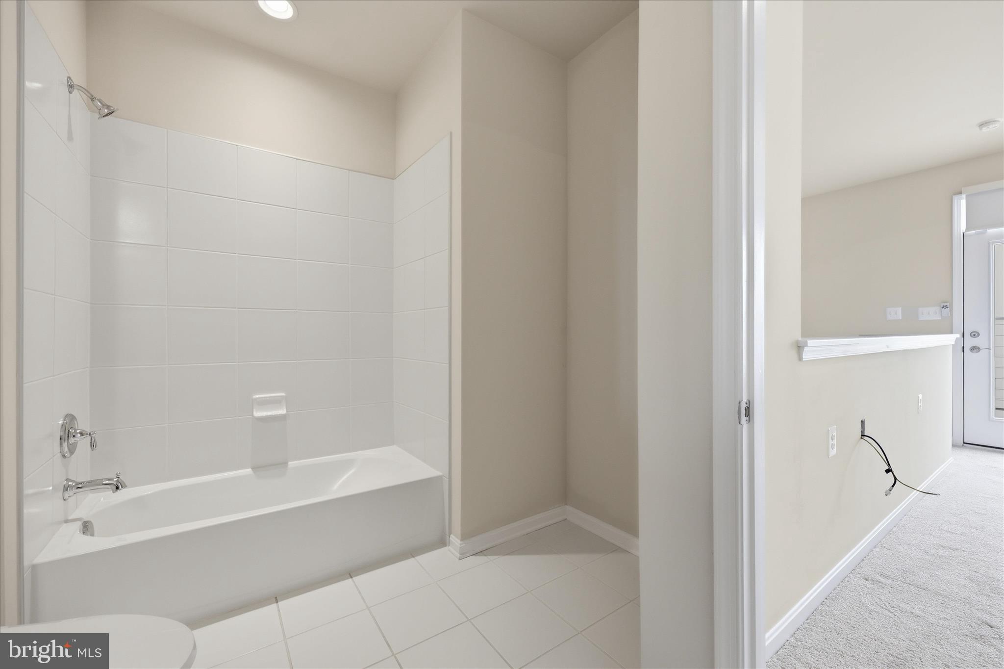 1090 Holden Road Frederick, MD 21701 - Photo 33 of 60 a spacious bathroom with a bathtub and a shower