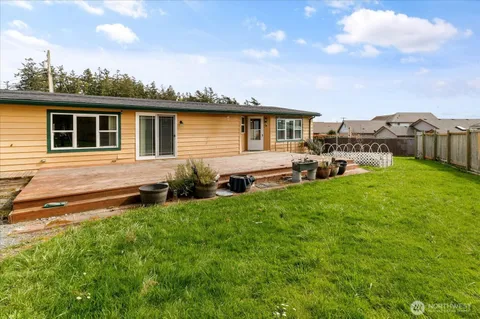 a view of a house with a backyard and windows