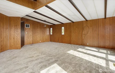 a view of a kitchen from a hallway
