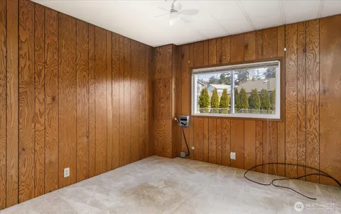 a view of a backyard with plants and a garden