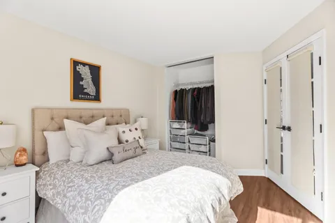 a bedroom with a bed and a closet