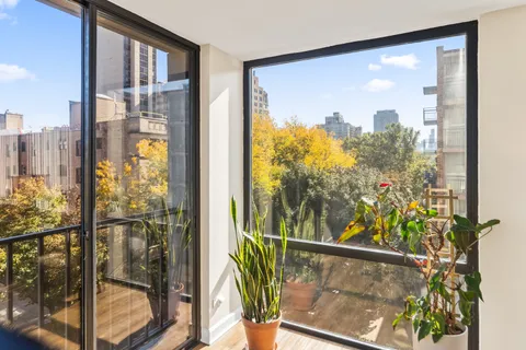 a view of a glass door with a balcony