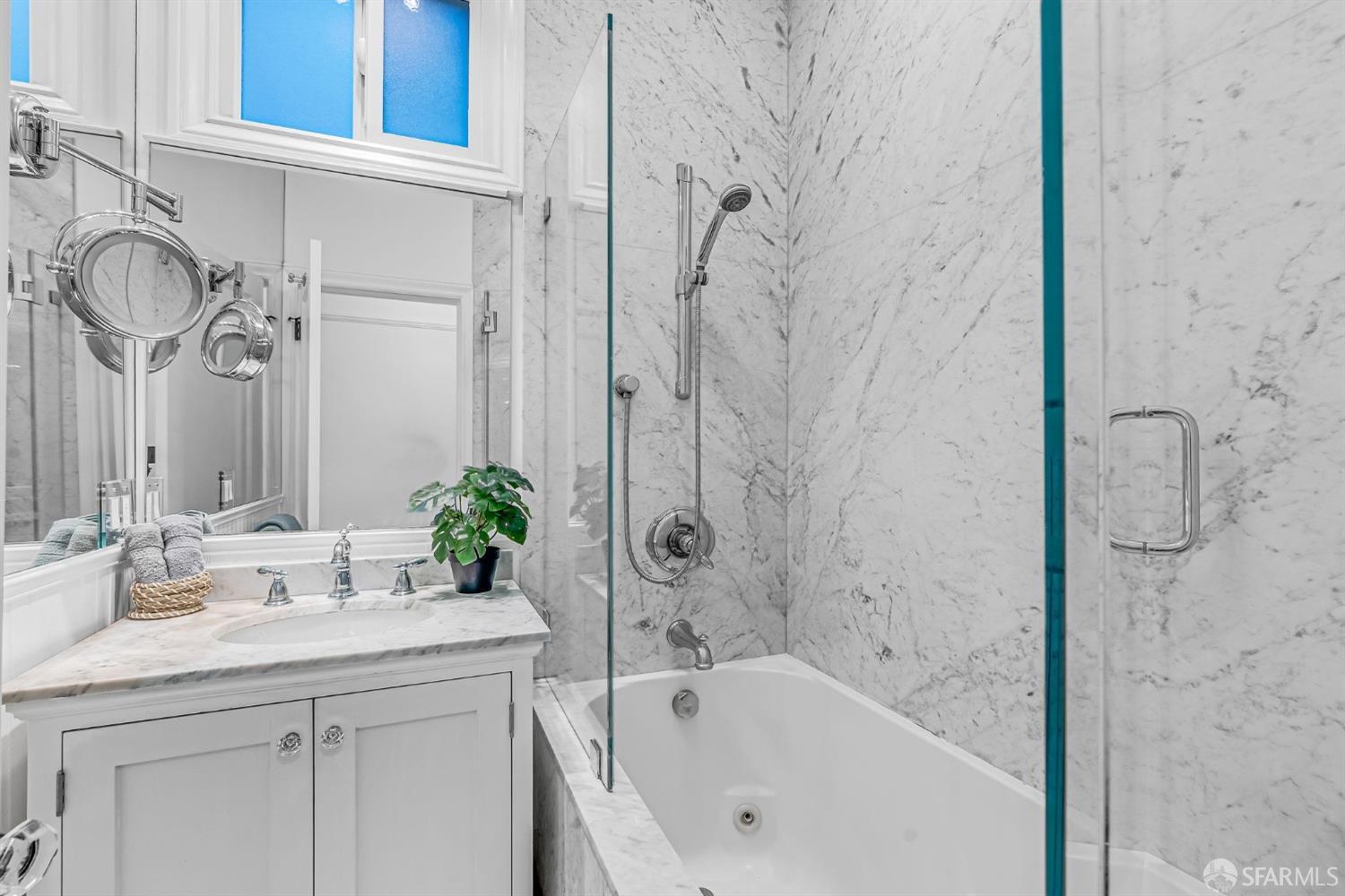 1049 Clay Street San Francisco, CA 94108 - Photo 16 of 28 a bathroom with a granite countertop sink a toilet and bathtub
