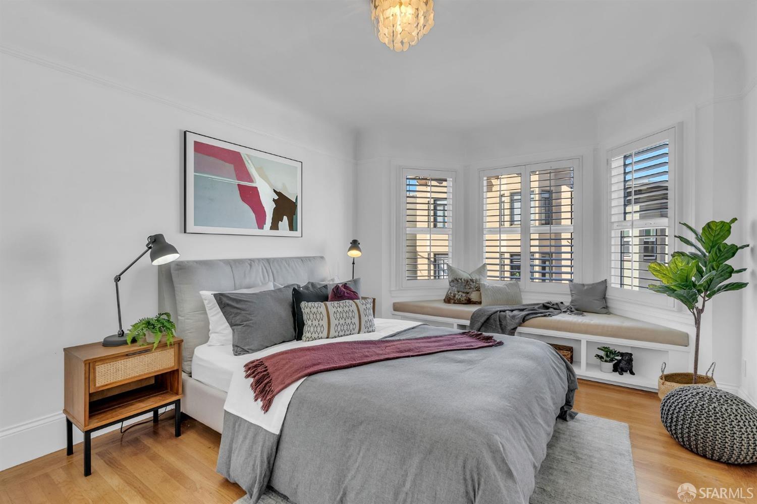 1049 Clay Street San Francisco, CA 94108 - Photo 9 of 28 a bedroom with furniture and a potted plant
