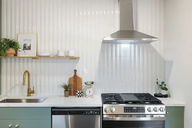 a kitchen with a stove and a sink