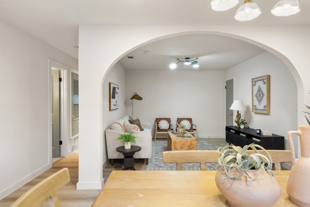 7614 Watson Street Austin, TX 78757 - Photo 11 of 31 a living room with furniture and a chandelier