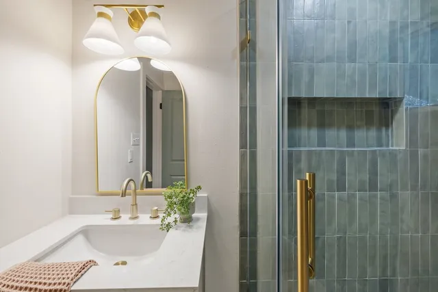 a bathroom with a sink and a mirror