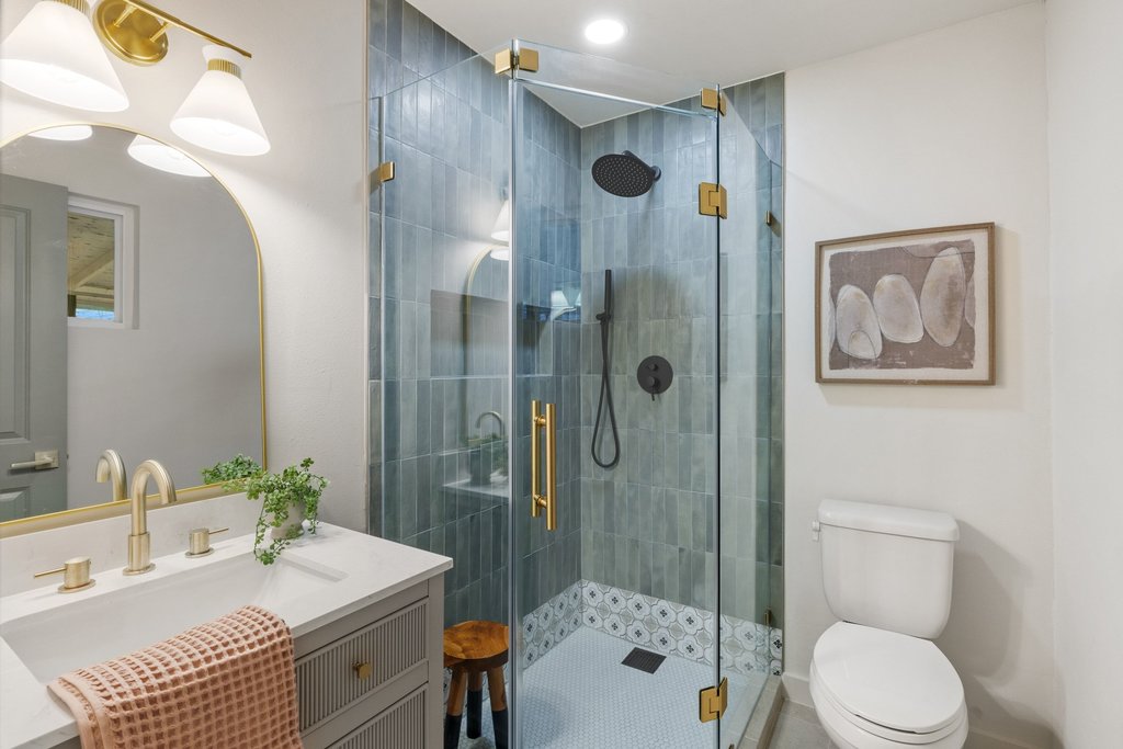 7614 Watson Street Austin, TX 78757 - Photo 22 of 31 a bathroom with a sink a toilet and shower