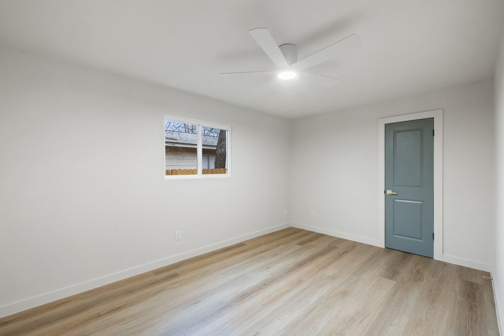 7614 Watson Street Austin, TX 78757 - Photo 23 of 31 a view of a room with wooden floor and white walls