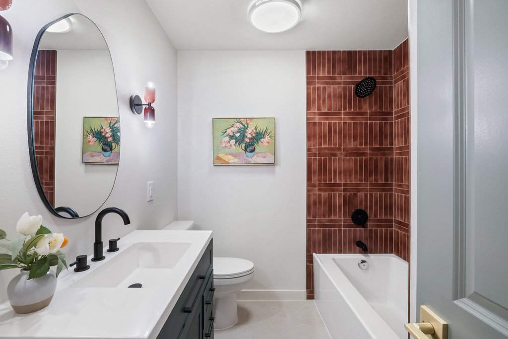 7614 Watson Street Austin, TX 78757 - Photo 25 of 31 a bathroom with a sink a toilet and shower