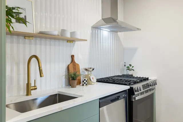 a kitchen with a sink and cabinets