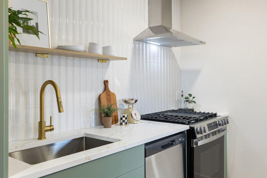 7614 Watson Street Austin, TX 78757 - Photo 10 of 31 a kitchen with a sink and cabinets