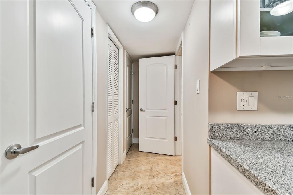 7701 Starkey Road, Unit 105 Seminole, FL 33777 - Photo 20 of 25 a view of a kitchen from the hallway