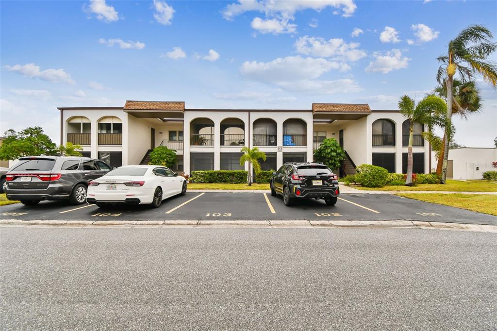 7701 Starkey Road, Unit 105 Seminole, FL 33777 - Photo 2 of 25 a car parked in front of a house