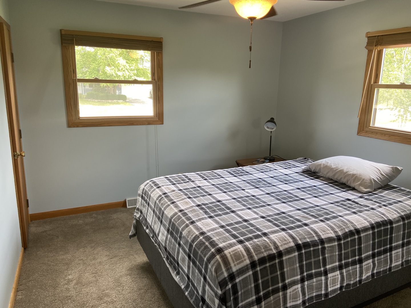 925 Knollside Road New Lenox, IL 60451 - Photo 13 of 32 a bedroom with a bed and a chandelier