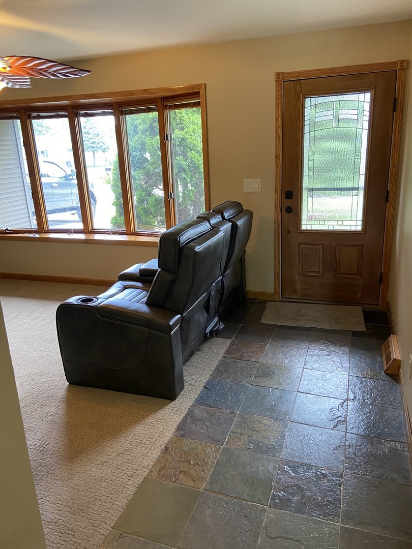 925 Knollside Road New Lenox, IL 60451 - Photo 7 of 32 a living room with furniture and a window
