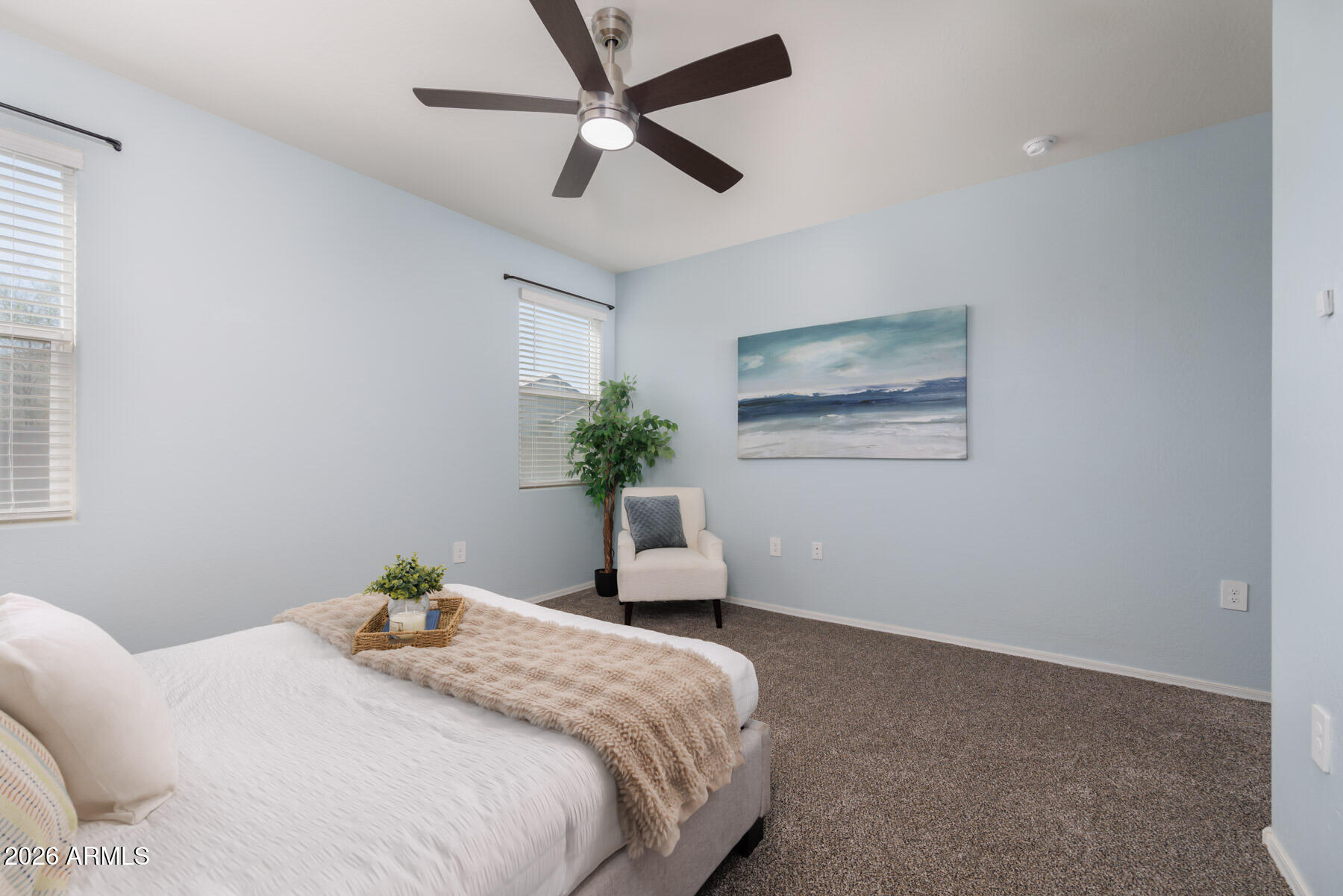 9381 Greenhouse Road Florence, AZ 85132 - Photo 13 of 35 a bedroom with a bed chandelier and a window