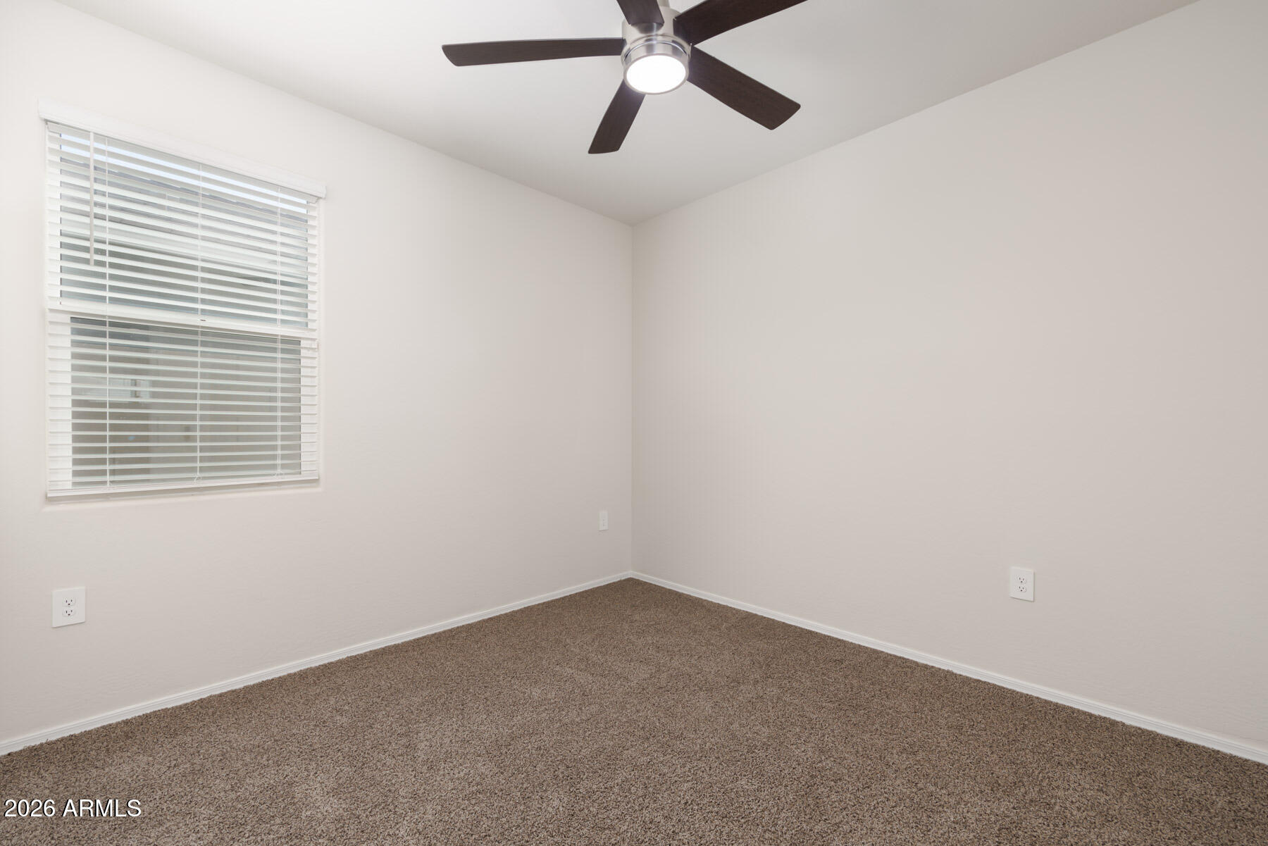 9381 Greenhouse Road Florence, AZ 85132 - Photo 15 of 35 an empty room with a window and a fan