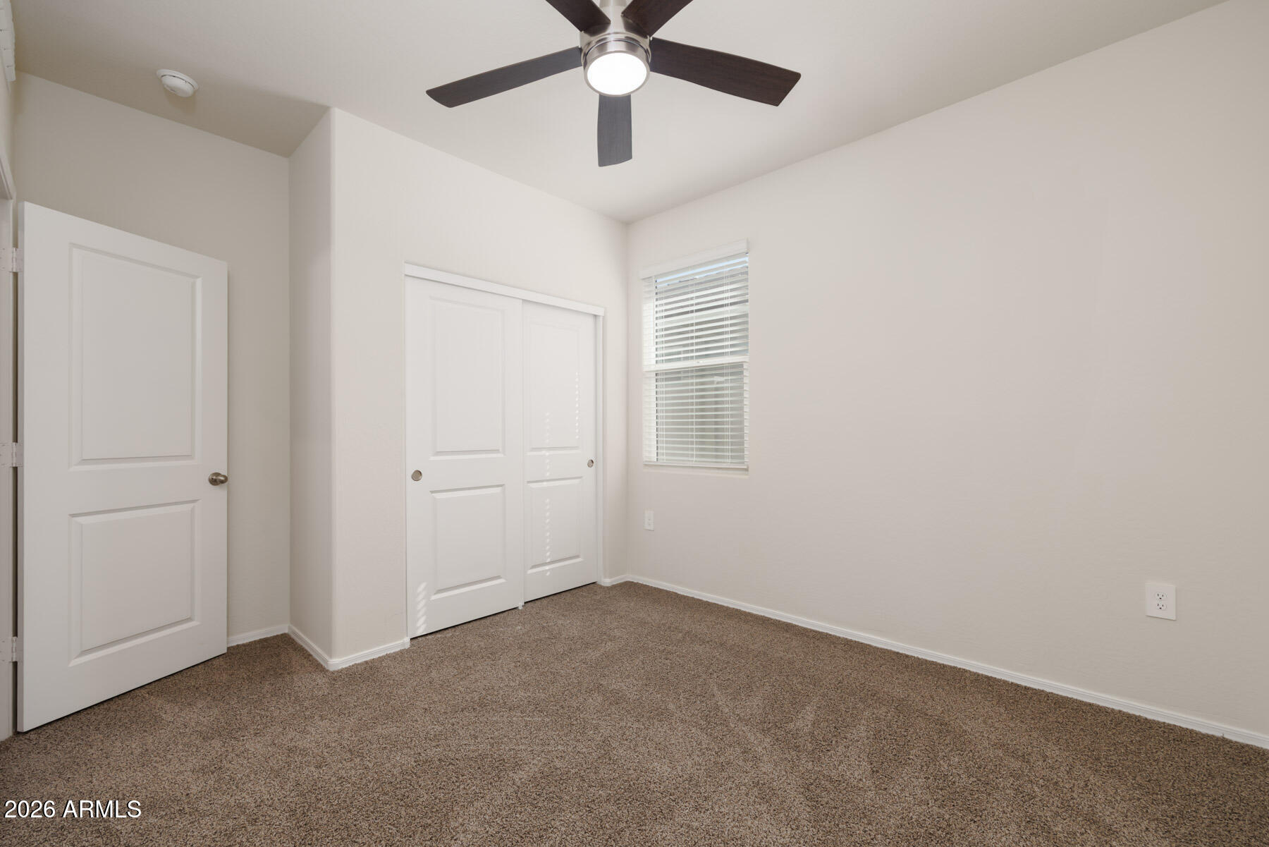 9381 Greenhouse Road Florence, AZ 85132 - Photo 16 of 35 an empty room with chandelier fan