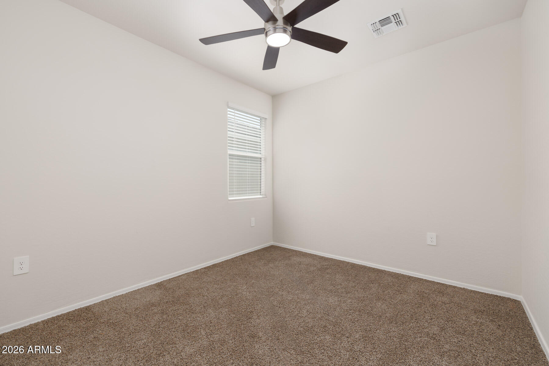 9381 Greenhouse Road Florence, AZ 85132 - Photo 19 of 35 an empty room with a window and a fan