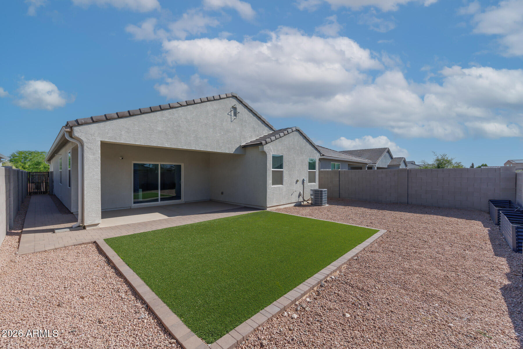 9381 Greenhouse Road Florence, AZ 85132 - Photo 24 of 35 a front view of a house with a garden and yard