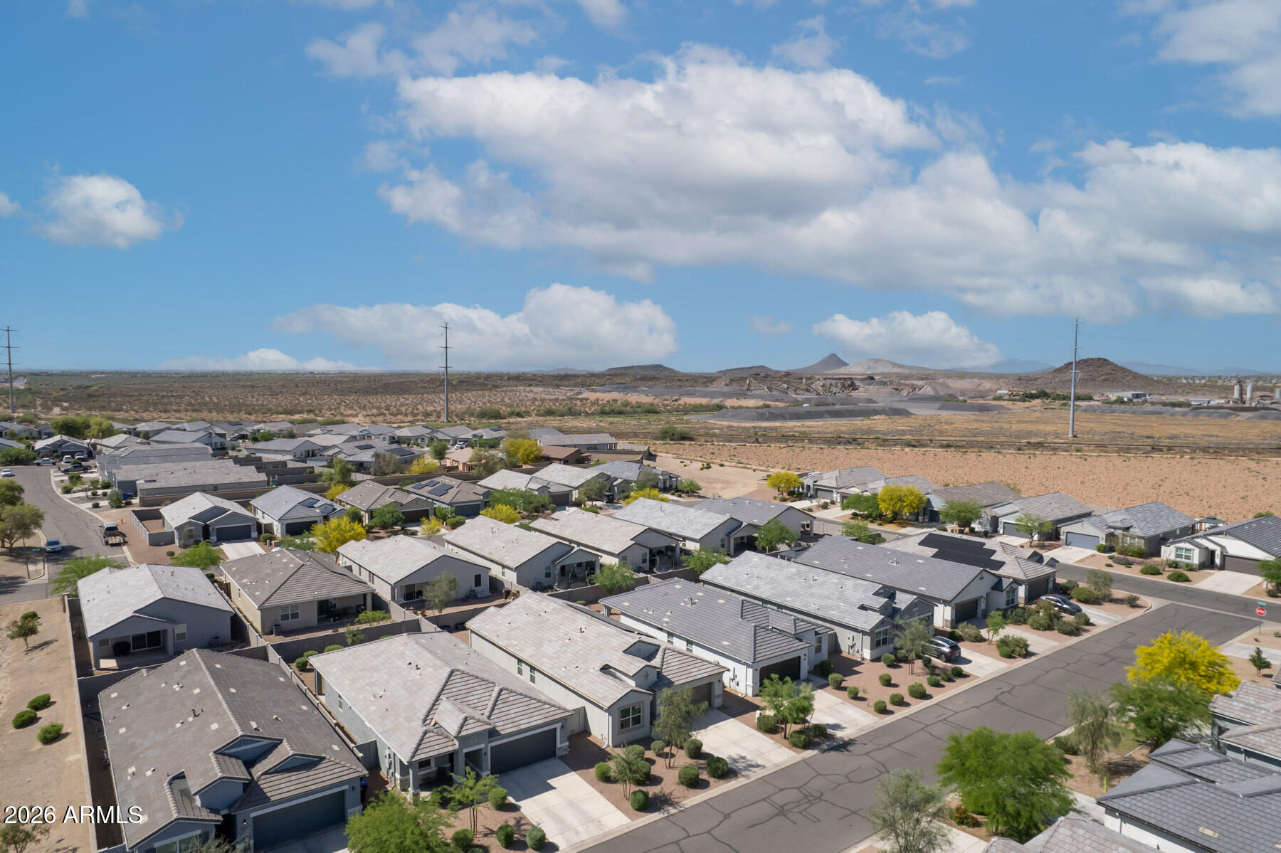 9381 Greenhouse Road Florence, AZ 85132 - Photo 30 of 35 an aerial view of a city with lots of residential buildings and ocean view in back