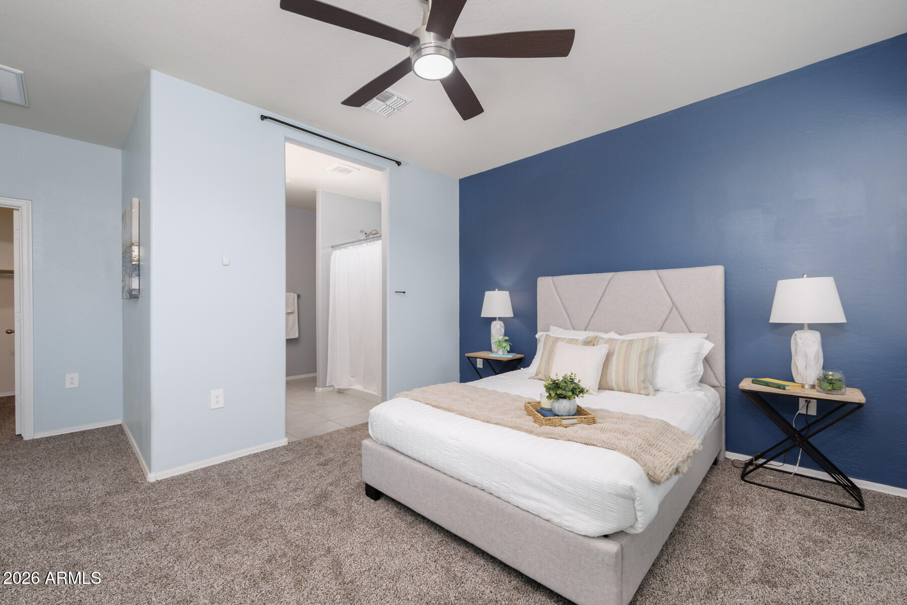 9381 Greenhouse Road Florence, AZ 85132 - Photo 3 of 35 a bedroom with a bed and a lamp