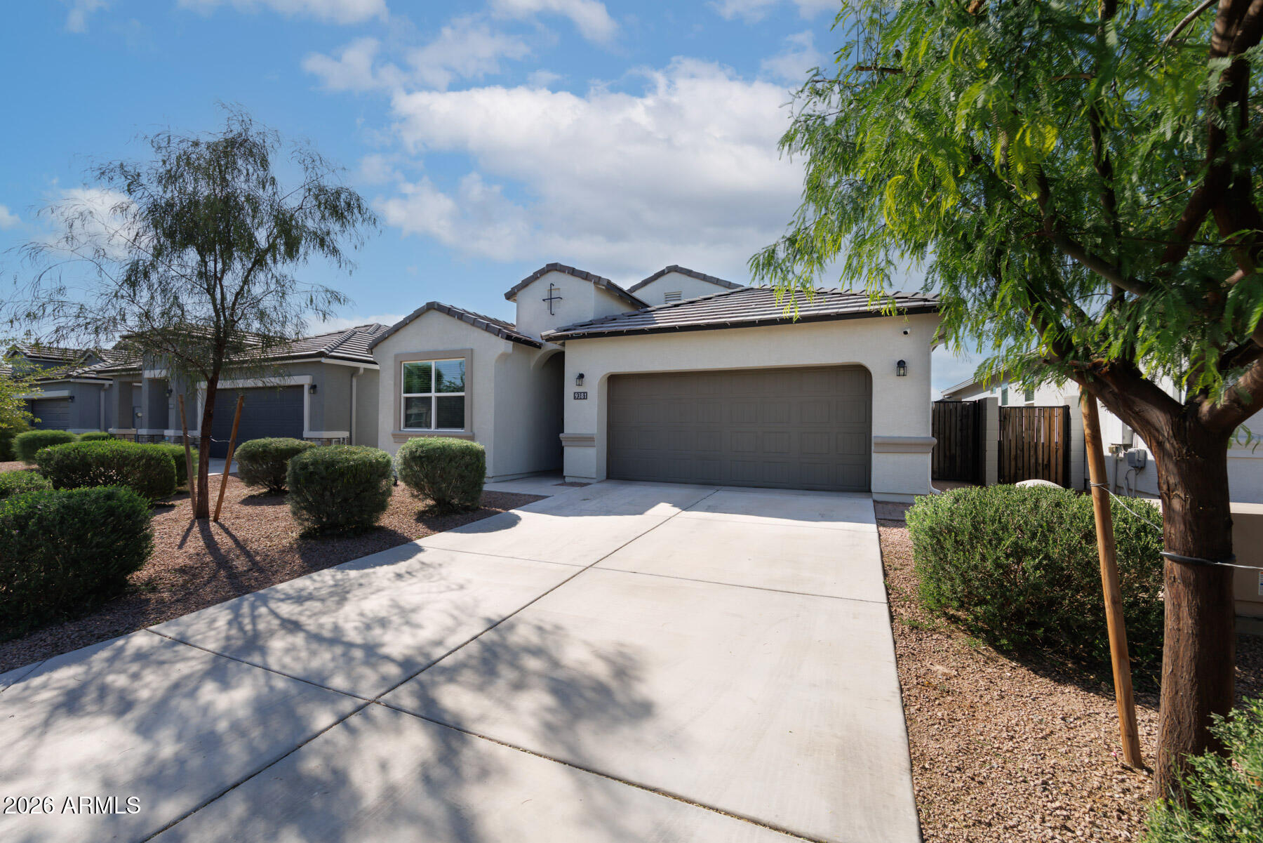 9381 Greenhouse Road Florence, AZ 85132 - Photo 4 of 35 a front view of a house with a yard and potted plants