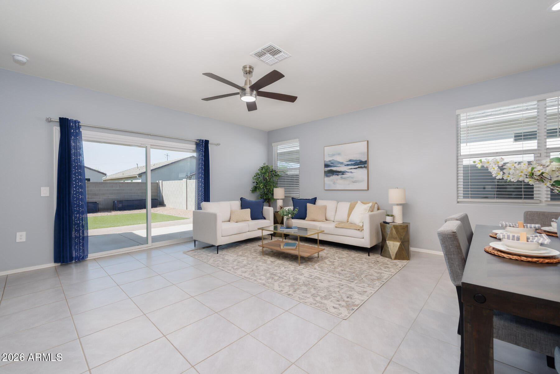 9381 Greenhouse Road Florence, AZ 85132 - Photo 7 of 35 a living room with furniture and a floor to ceiling window