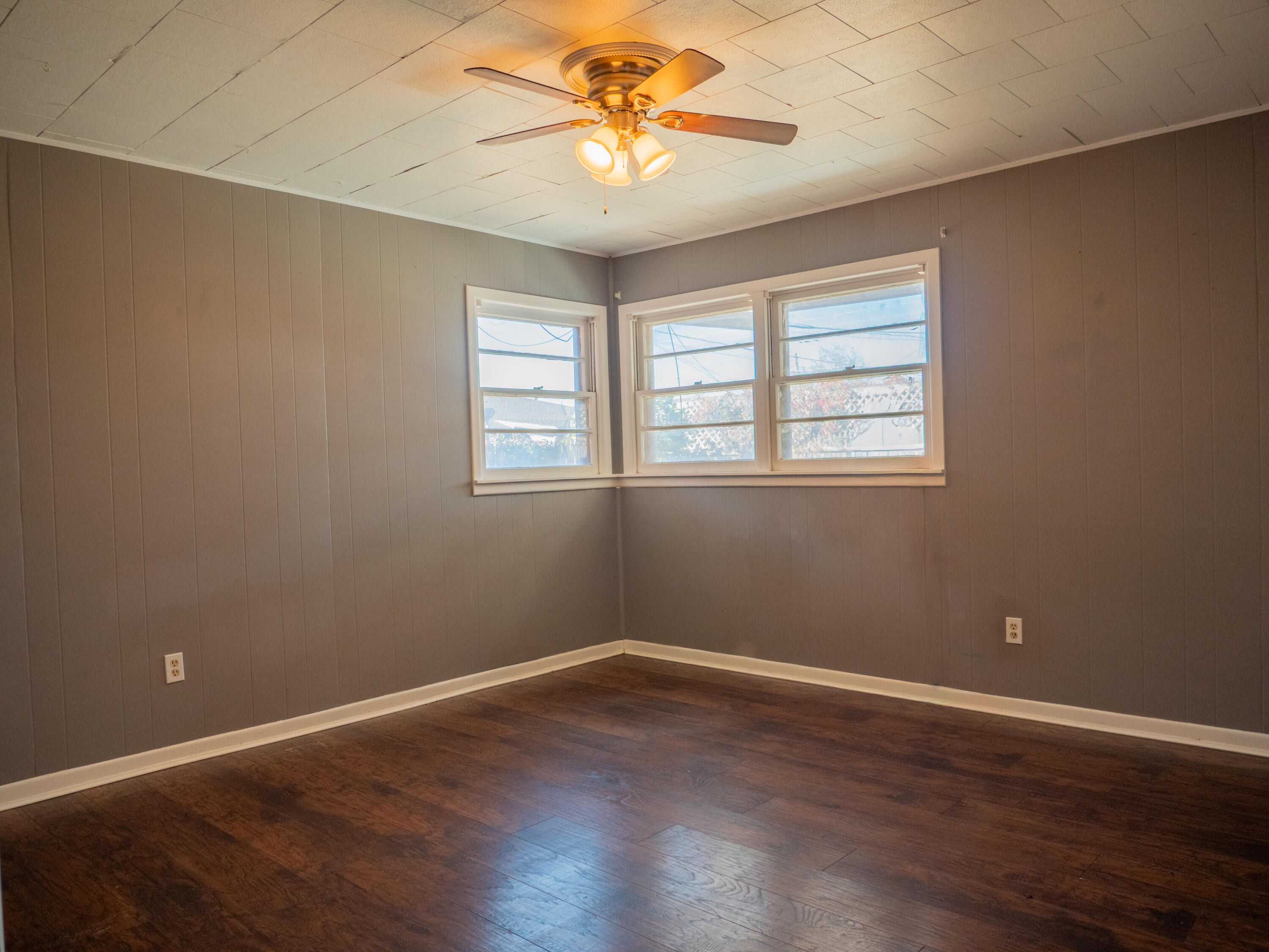3415 48th Street Lubbock, TX 79413 - Photo 12 of 19 an empty room with a window and a fan