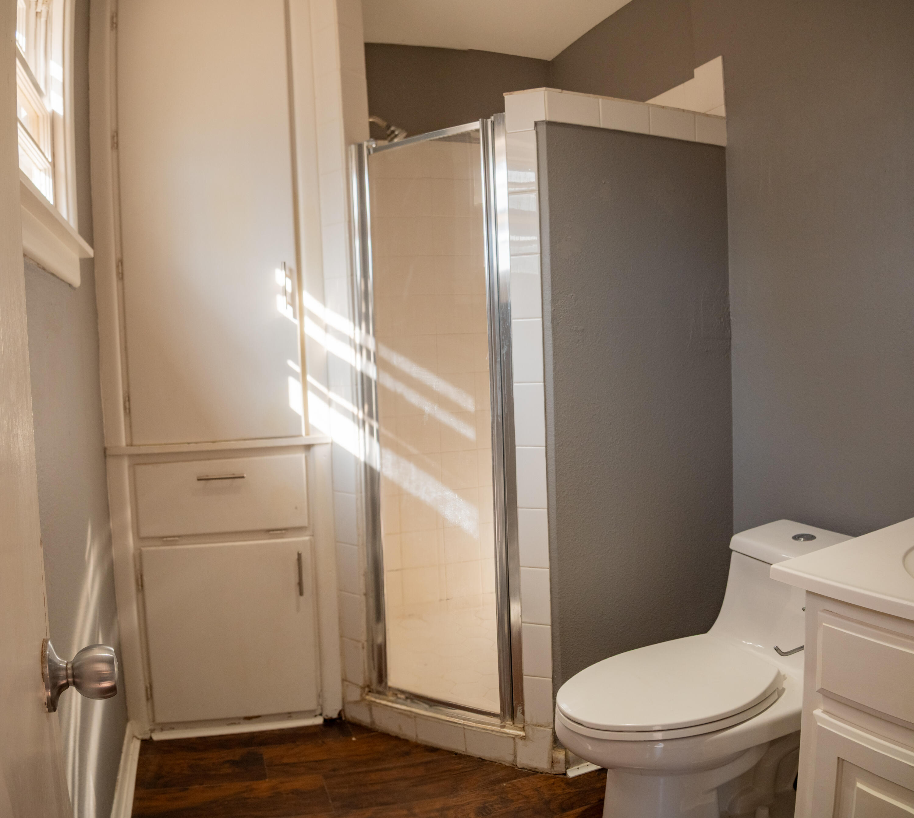 3415 48th Street Lubbock, TX 79413 - Photo 14 of 19 a bathroom with a toilet and a shower