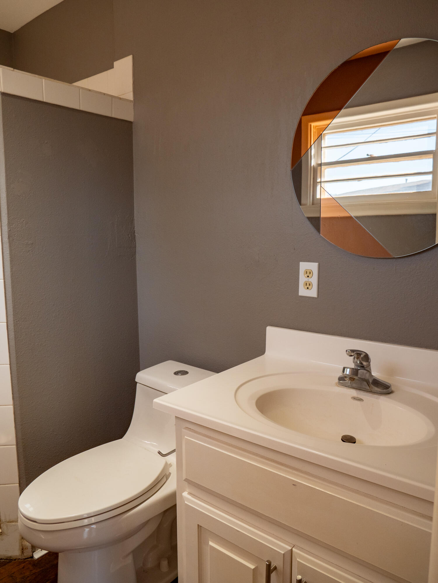 3415 48th Street Lubbock, TX 79413 - Photo 15 of 19 a bathroom with a sink and a toilet