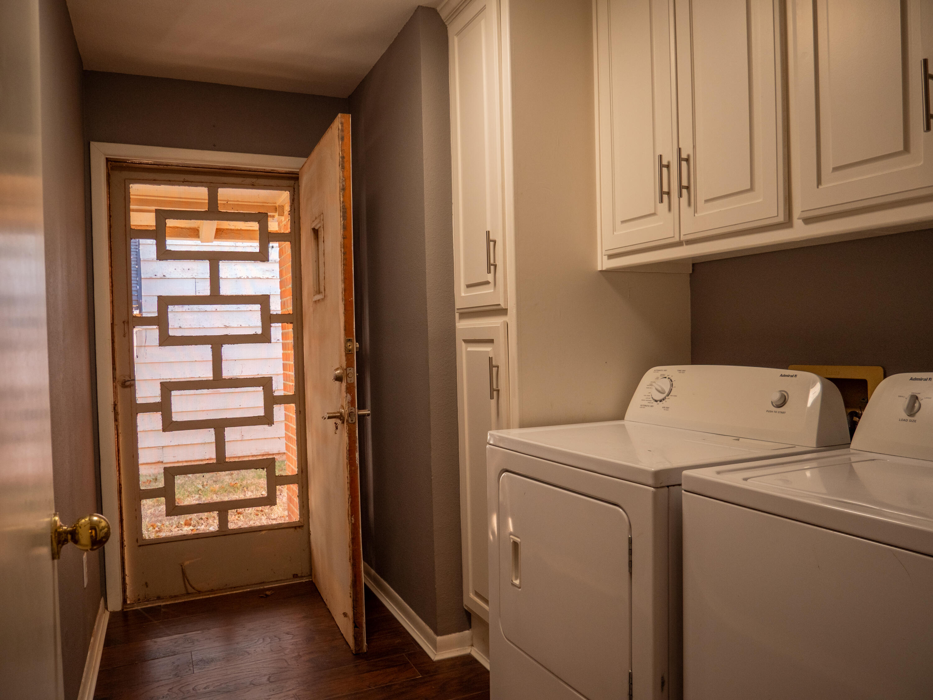 3415 48th Street Lubbock, TX 79413 - Photo 18 of 19 a view of storage and utility room with washer and dryer
