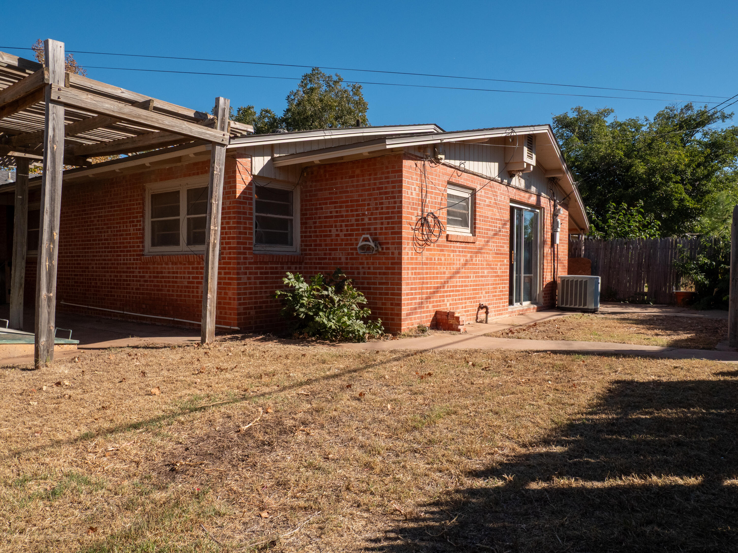3415 48th Street Lubbock, TX 79413 - Photo 19 of 19 a front view of a house with a yard