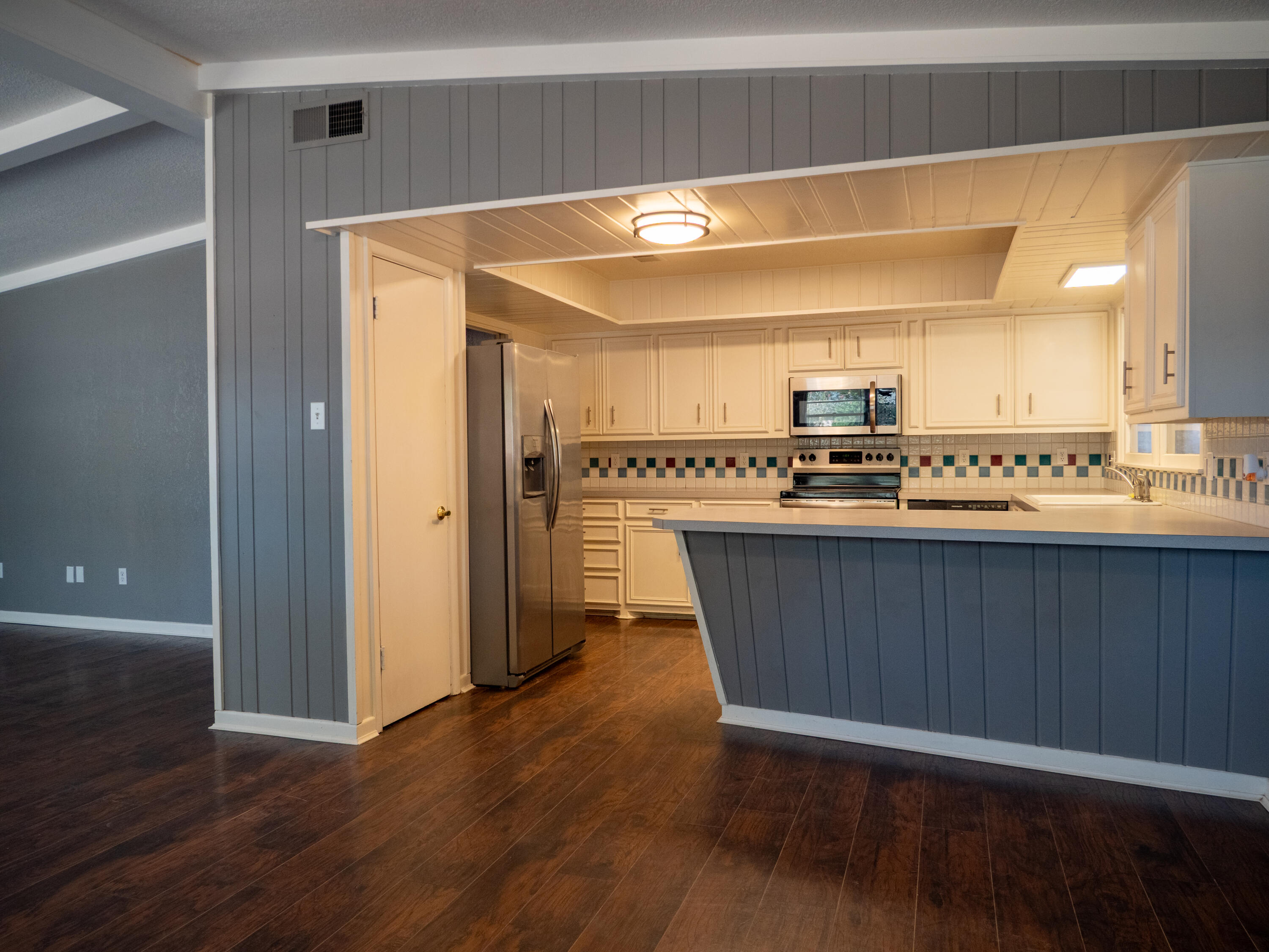3415 48th Street Lubbock, TX 79413 - Photo 2 of 19 a view of kitchen with stainless steel appliances wooden floor